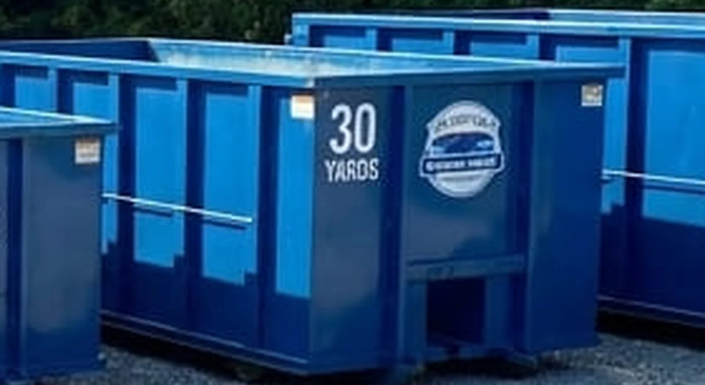 A clean, correctly-labeled 30 yard HNV Brothers Dumpster Rental roll-off container staged at the company yard