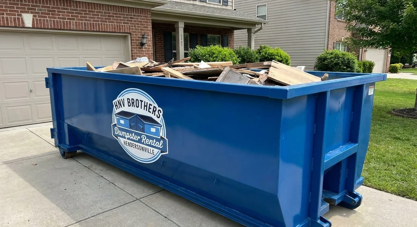 HNV Brothers Dumpster Rental blue roll-off dumpster staged on a residential driveway in Hendersonville, NC